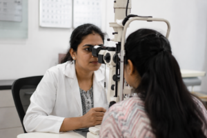 Elderly patient undergoing eye pressure test for glaucoma screening at clinic 